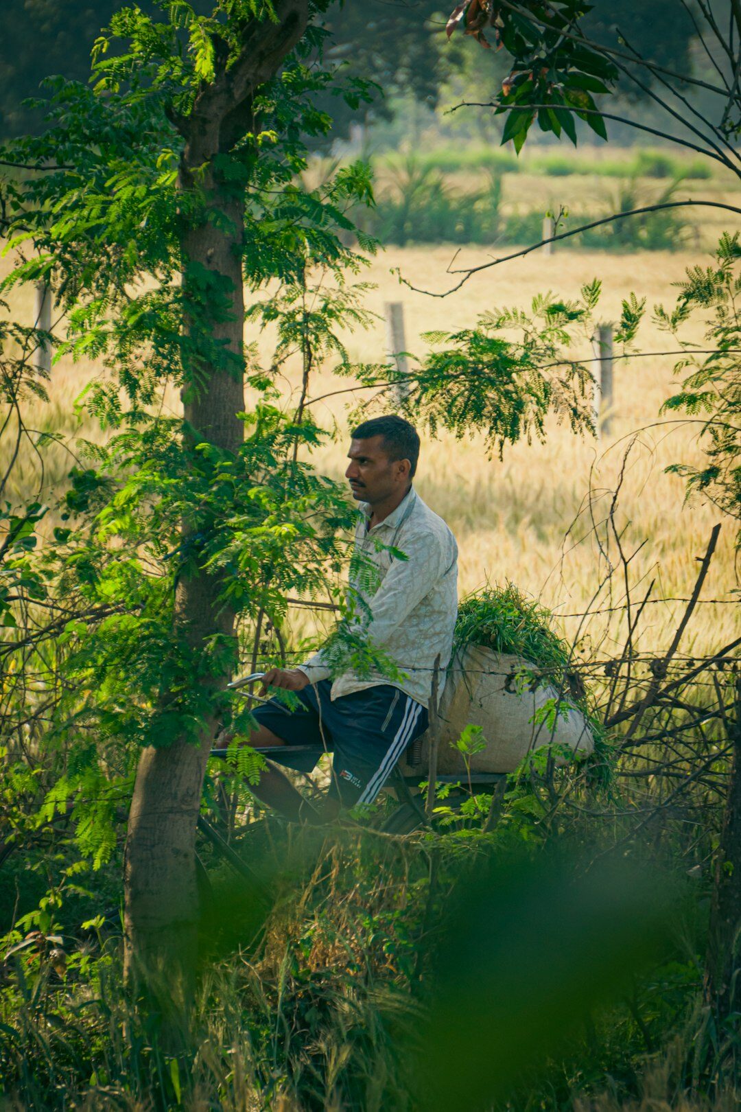 photographer with camera in village