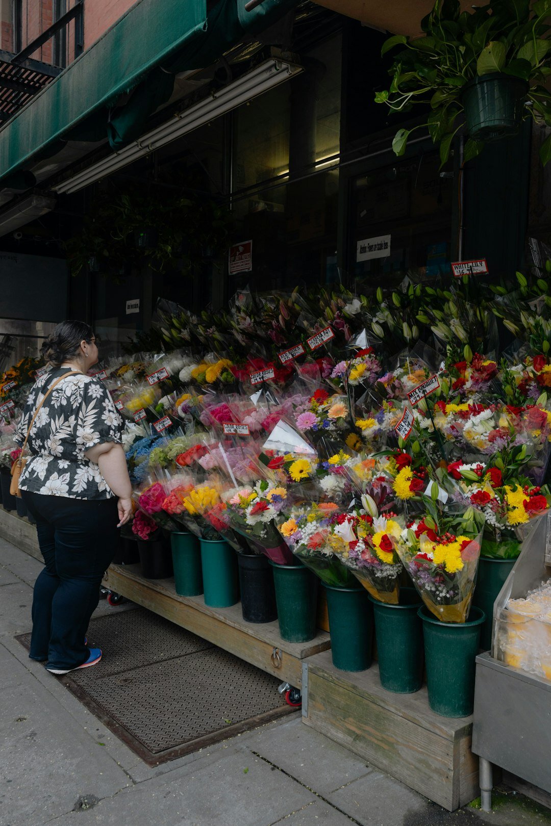 elderly woman in flower shop