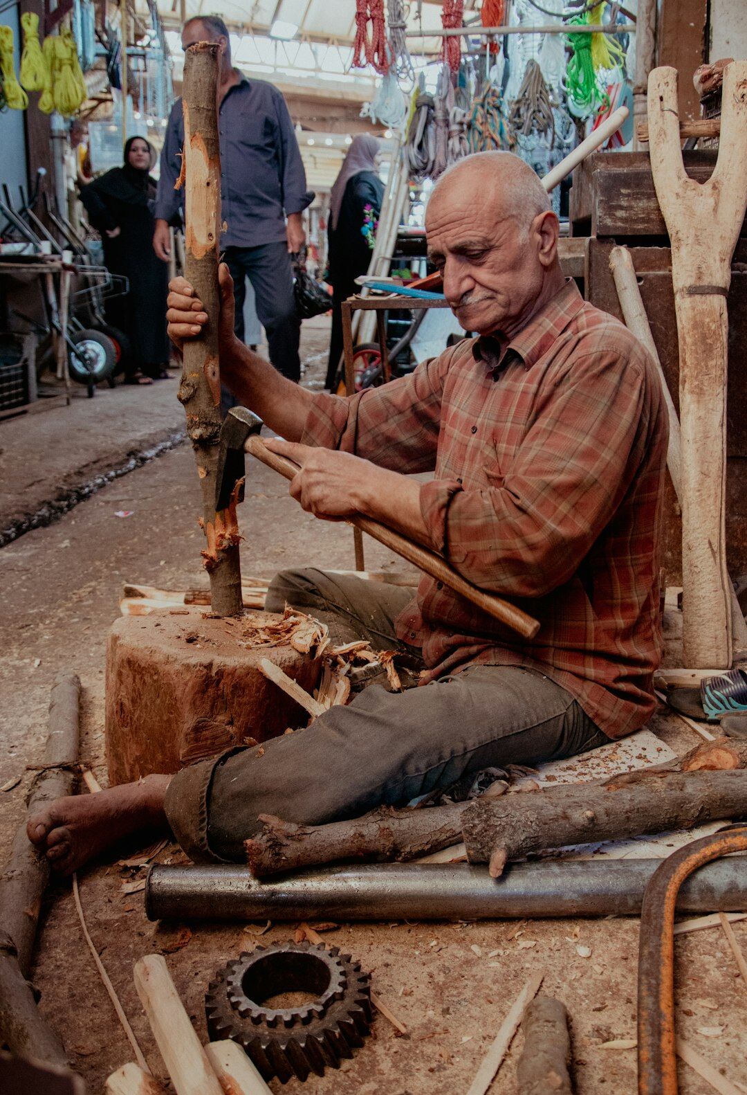 elderly craftsman working